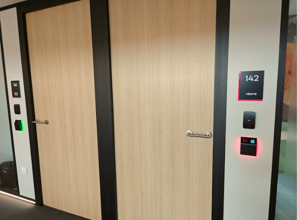 Meeting room booking display at Le PIC coworking campus in France