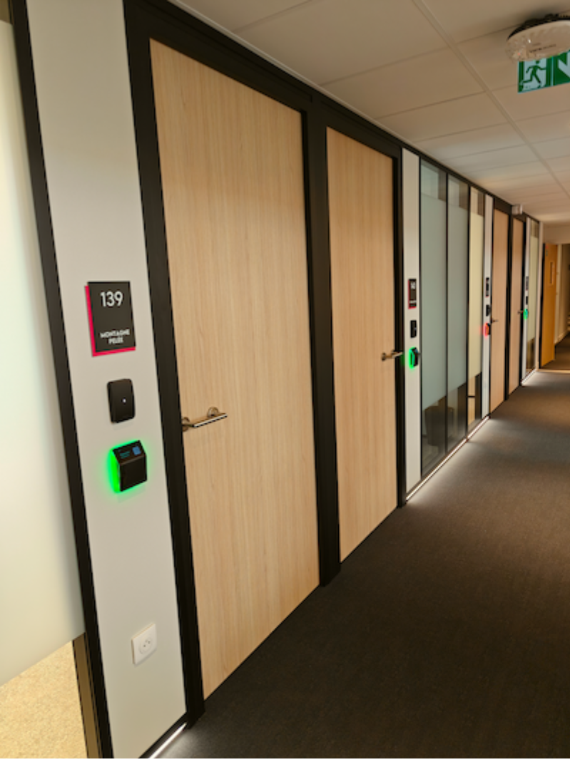 Meeting room booking display at Le PIC coworking campus in France